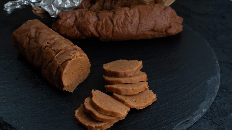 cooked seitan sausages on slate