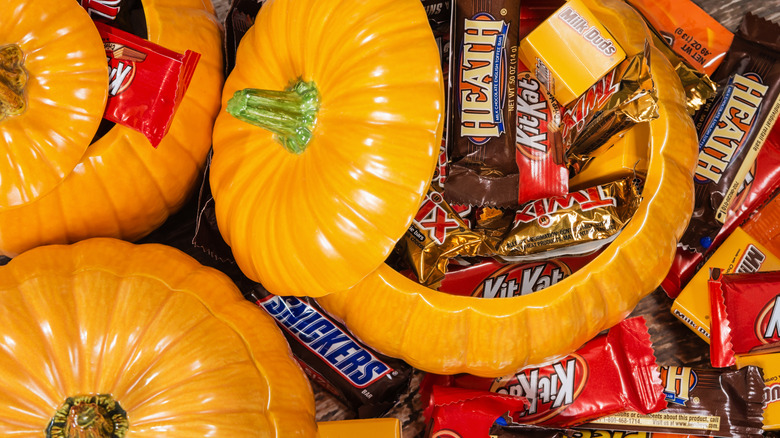 Pumpkins with assorted Halloween candy