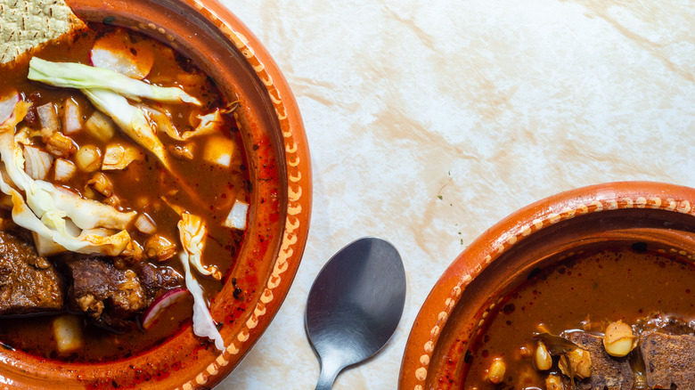 Pozole in brown bowls