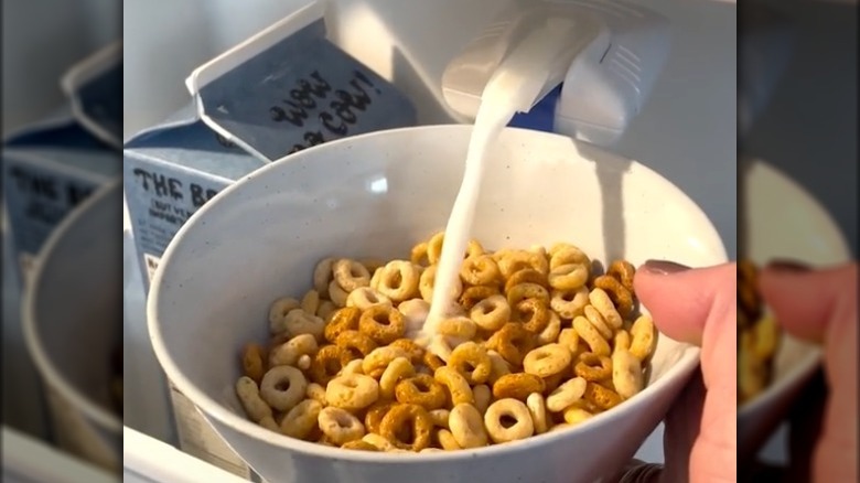 Adding milk to cereal