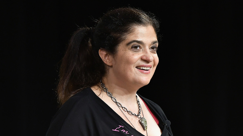 Alex Guarnaschelli sporting a black top