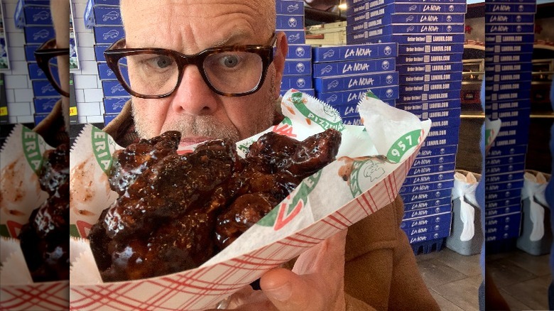 Alton Brown with Buffalo chicken wings
