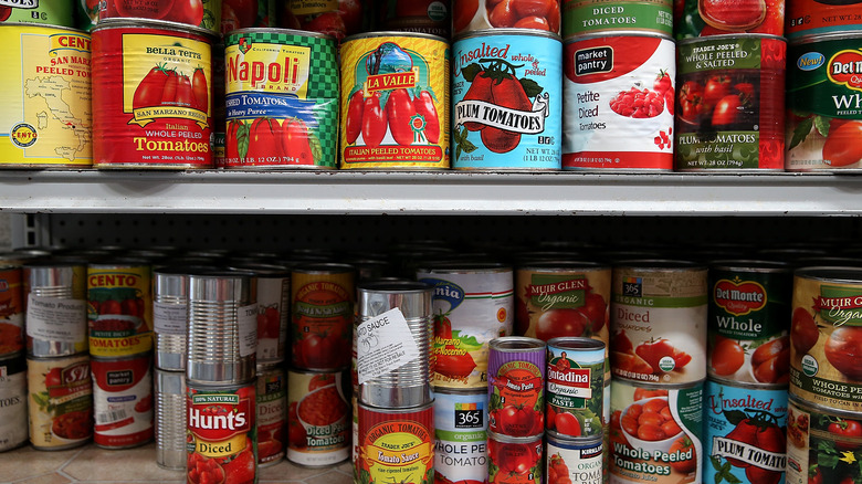 Canned tomatoes on store shelves