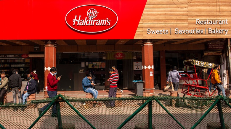 Haldiram's store front with diners