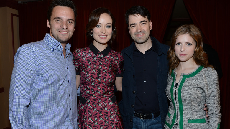 Jake Johnson, Olivia Wilde, Ron Livingston and Anna Kendrick with arms around each other