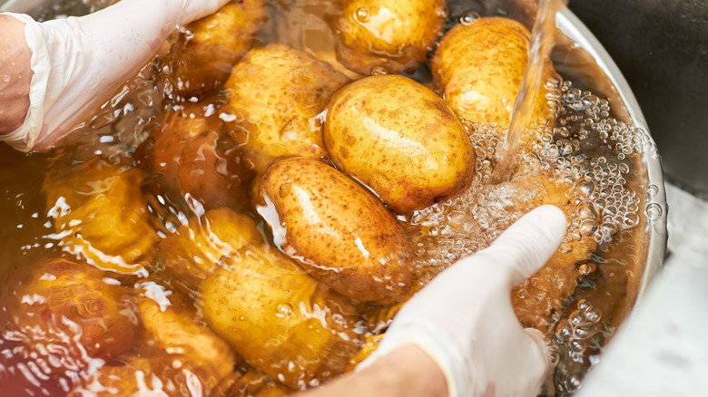 washing potatoes