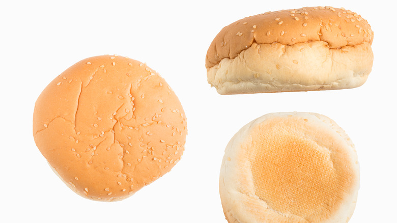 Three hamburger buns on a white background