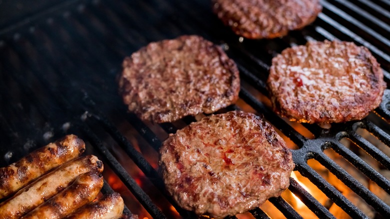 Burgers cooking on a grill