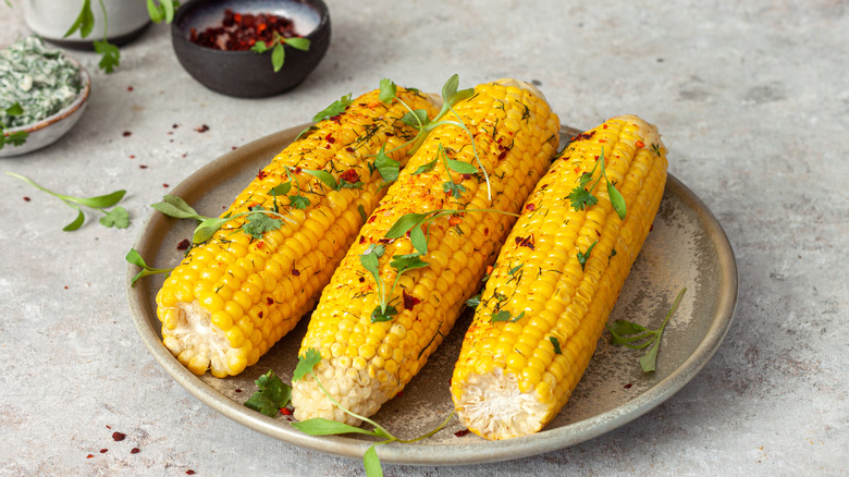 Flavored butter with chile and corn on the cob