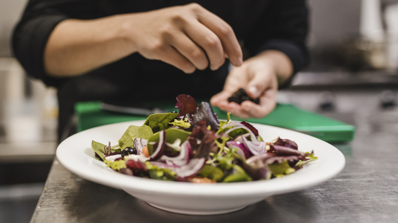 Chef preparing a salad