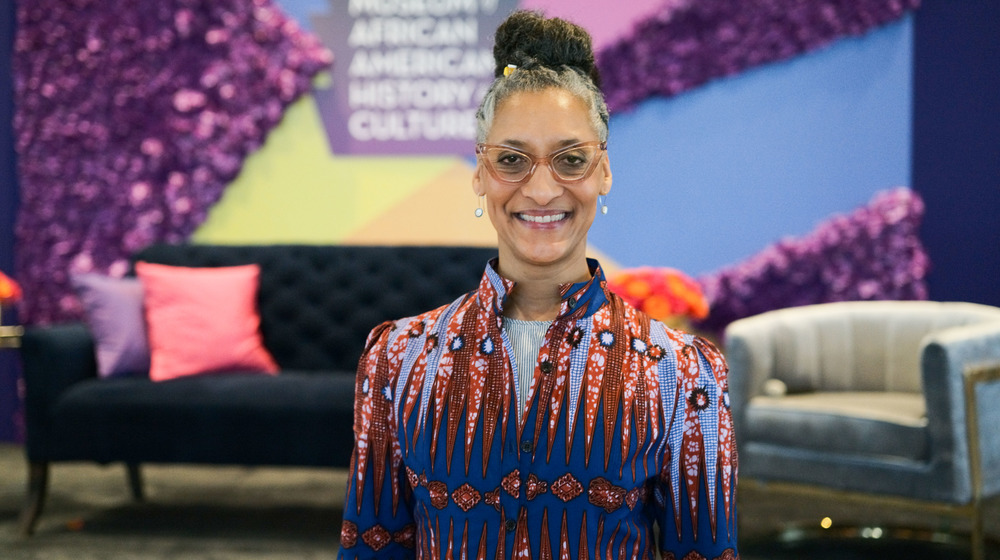 Colorful Carla Hall smiling