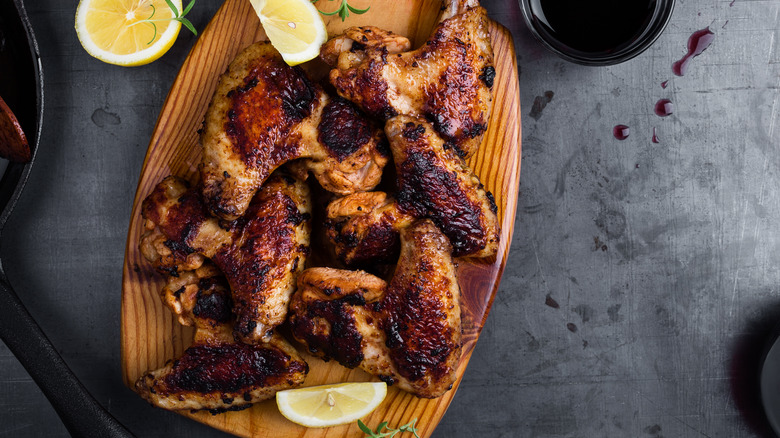 Chicken wings on wooden board