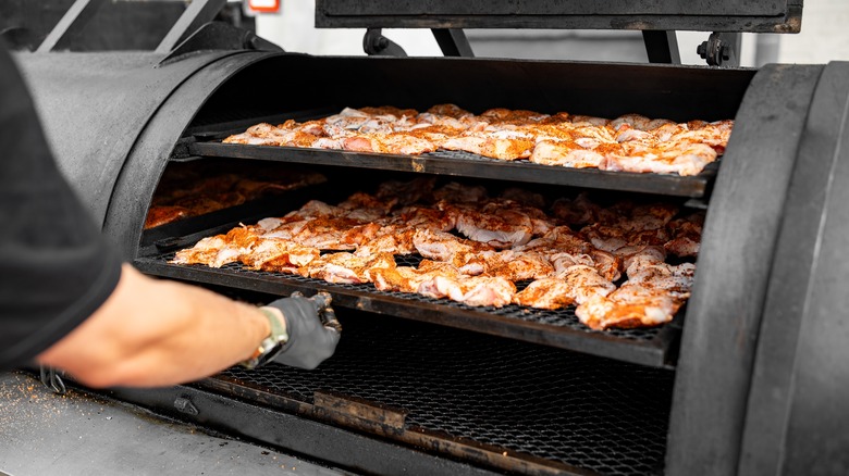 Chicken wings in a smoker