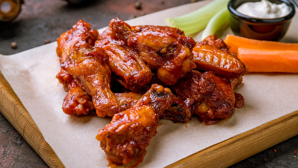 Chicken wings on board with veggies and ranch