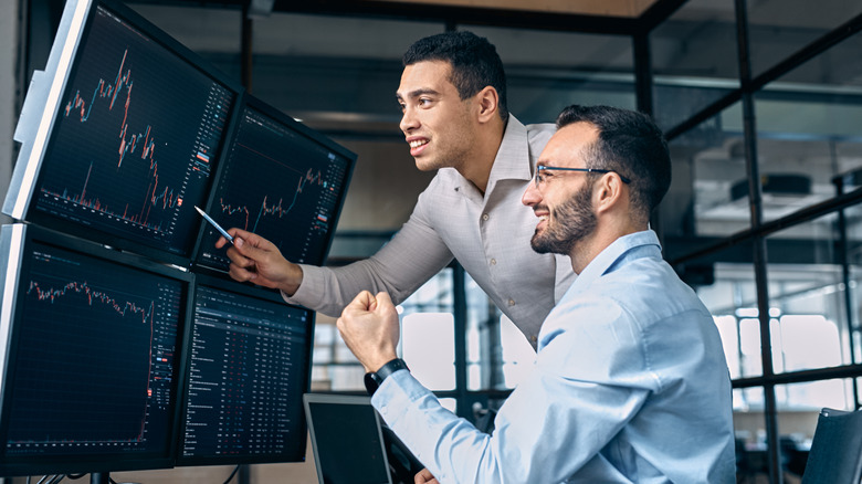 guys looking at a computer screen