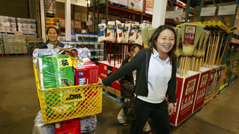 Costco shoppers pushing cart