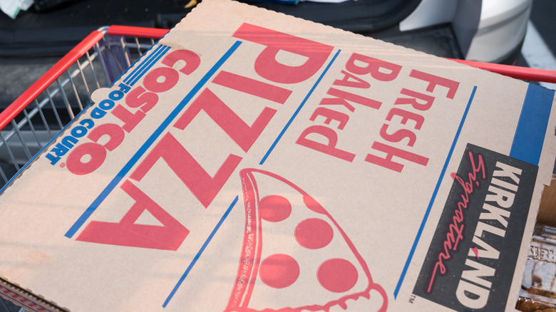 Costco pizza box on top of a cart