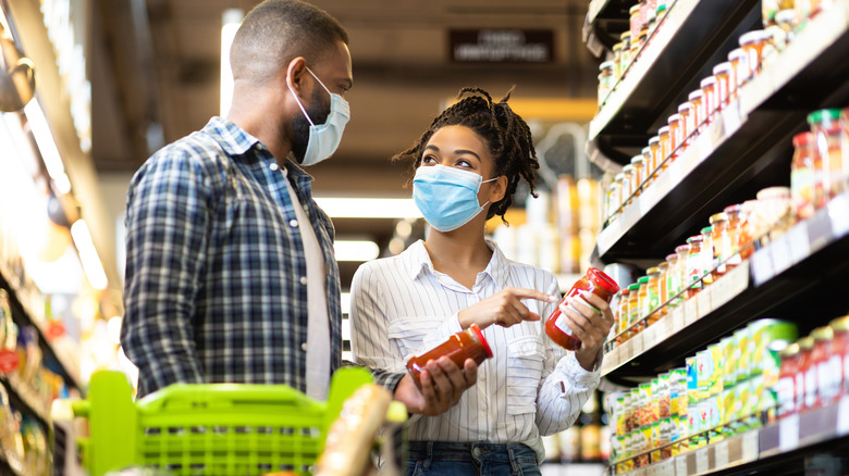 People in grocery aisle