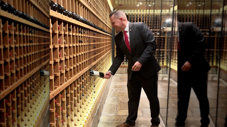 sommelier in restaurant wine cellar