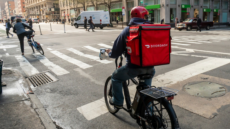 DoorDash delivery person on bicycle