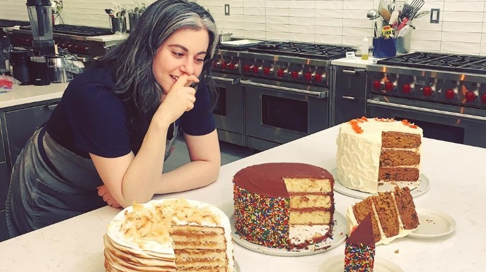 Chef Claire Saffitz looking at cake