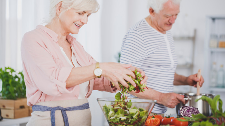 couple preparing a salad 