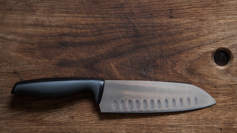 Santoku knife on a wooden board