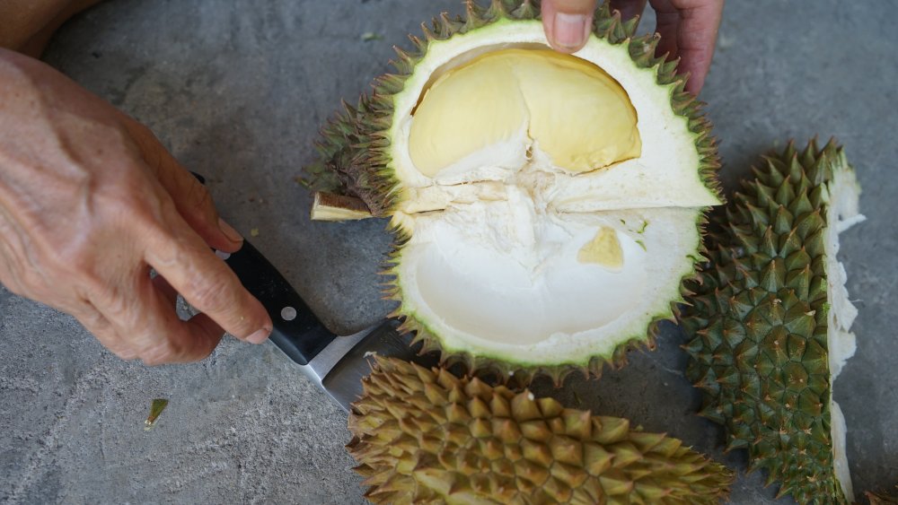 cutting open durian