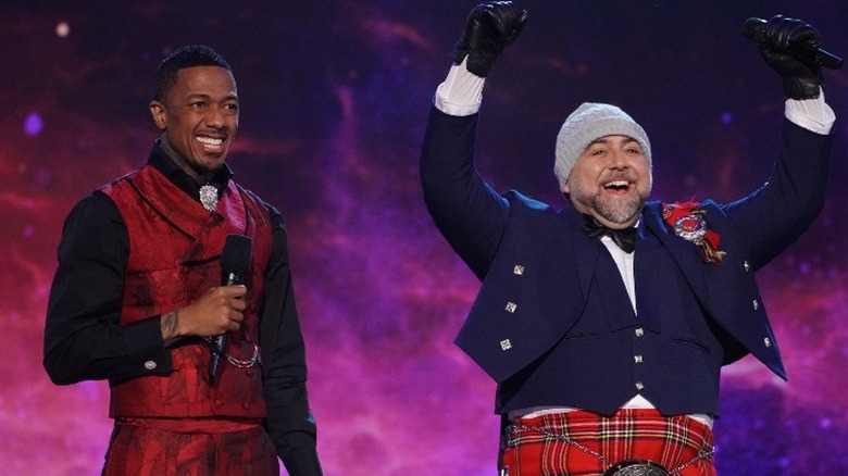 Nick Cannon and Duff Goldman smiling on stage