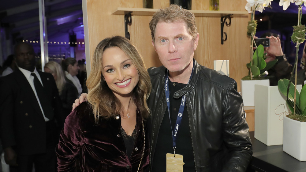 Giada De Laurentiis and Bobby Flay posing 