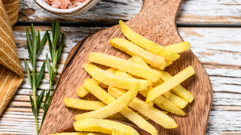 french fries on cutting board