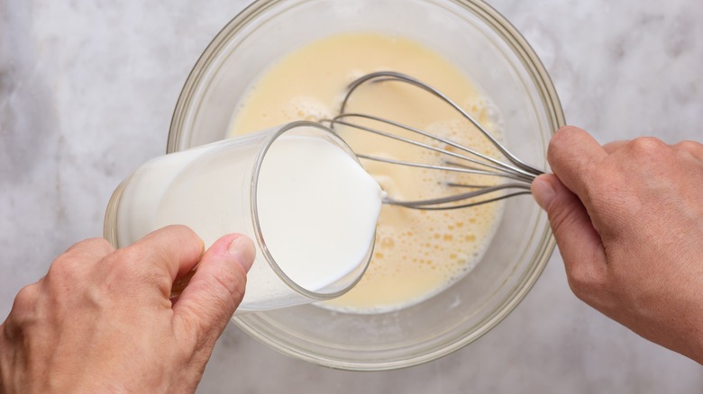 Whisking milk into eggs