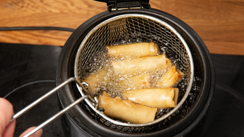 spring rolls frying