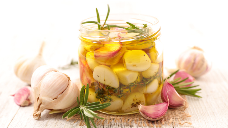 Garlic confit in glass jar