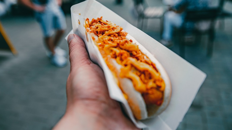 Hot dog in hand