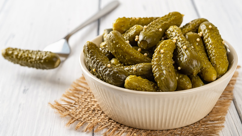 Gherkins in a bowl and fork