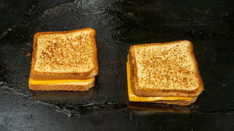 grilled cheese sandwiches on a flat griddle