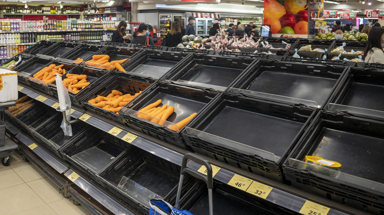 Empty grocery store produce bins