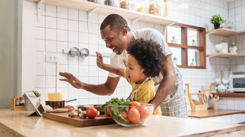 Father and child cooking