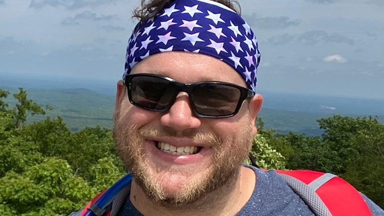 Steven Sechoka smiling wearing bandana