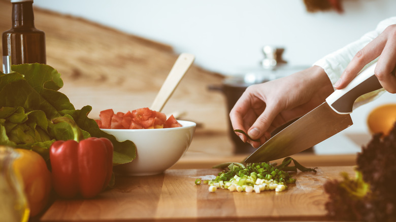 Dicing scallions and tomatoes