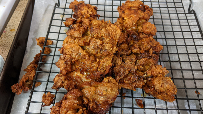 Fried chicken on cooling rack