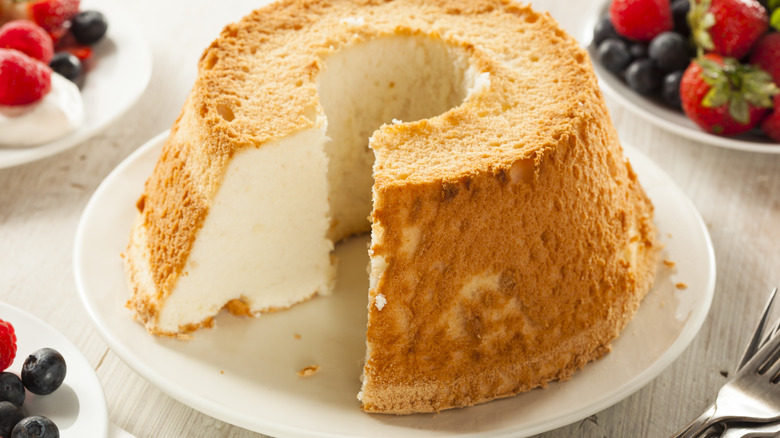 Sliced angel food cake and berries