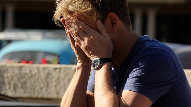 Ramsay resting head in his hands