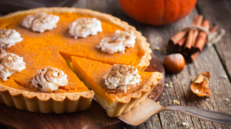 Pumpkin pie with slice removed