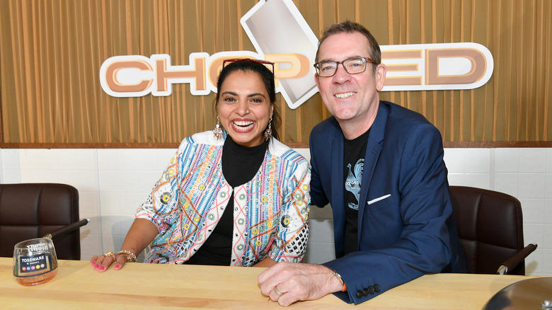 Maneet Chauhan and Ted Allen smiling