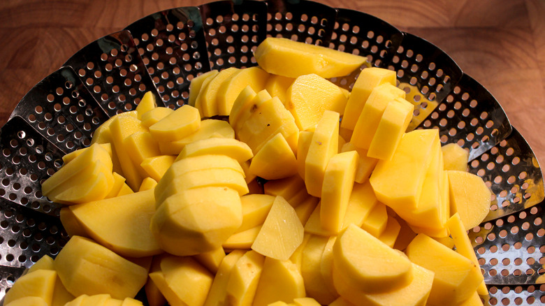 potatoes in a steamer basket