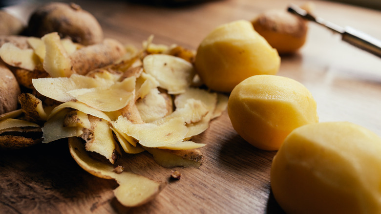 peeled potatoes with peelings