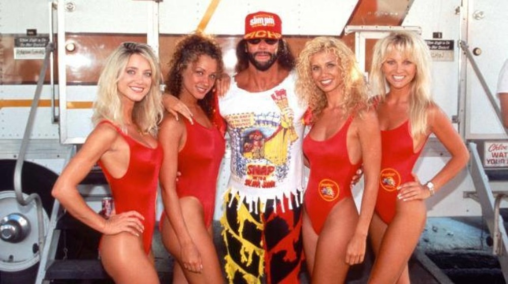 Randy Savage and models promoting Slim Jims at WCW event