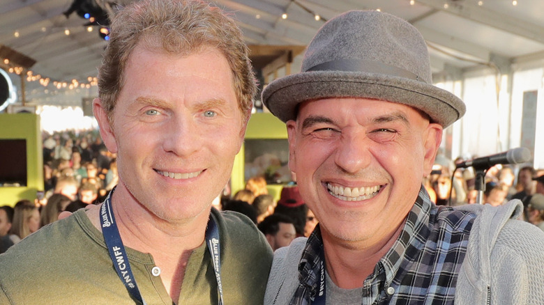 Bobby Flay and Michael Symon smiling